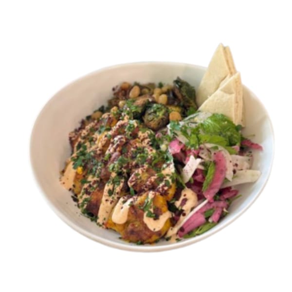 A Lulu's Little Kitchen bowl with falafel, salad, roasted vegetables, and pita bread.