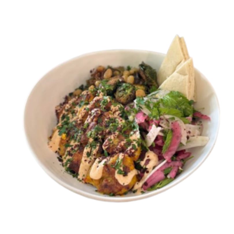 A Lulu's Little Kitchen bowl with falafel, salad, roasted vegetables, and pita bread.